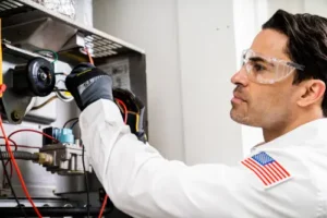 Closeup of a One Hour AC Tech working inside of an HVAC unit at a home in Lakeland, FL