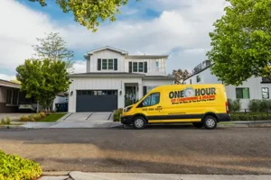 Wide view of a One Hour Air Conditioning Van parked outside a home in Lakeland, FL